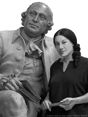 Wendy Ross next to a clay model of George Mason