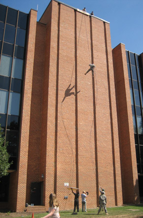 Photo of ROTC cadets rappeling down a building